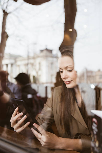 istock Woman with tablet in coffee shop 474733626