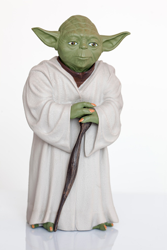 istanbul, Turkey - May 22, 2015: Portrait of Jedi Master Yoda toy model, from director George Lucas's legend Star Wars Film. Shot on white background.