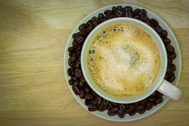 istock Coffee cup on wooden table. View from the top 474737122