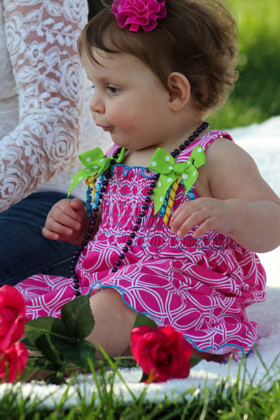 istock Baby Girl Sits by Grown-up 474737944