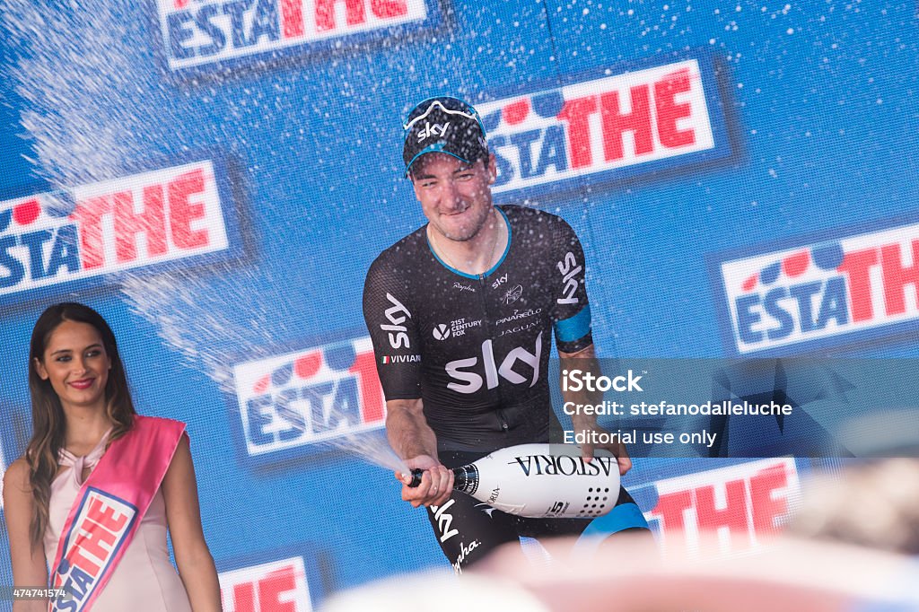 Elia Viaviani on the podium Genova, Italy - May 10, 2015: Genova, Italy - May 10 2015: Elia Viviani (TEAM SKY) celebrates on the podium of the second stage Albenga - Genova of Giro D'italia 2015 Stock Photo