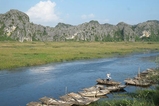 Ninhbinh, Vietnam - November 27, 2014: Caves popular tourist boats in Van Long, Vietnam on Nov 27, 2014. Van Long is famous ecotourims of NinhBinh, Vietnam.