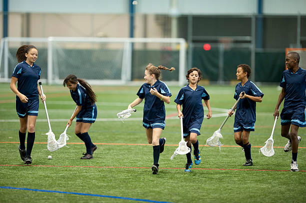 istock Young lacrosse team run on field 474745423