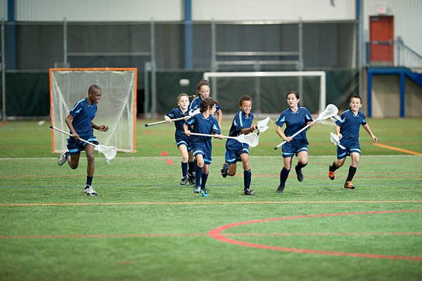 Young lacrosse team run on field