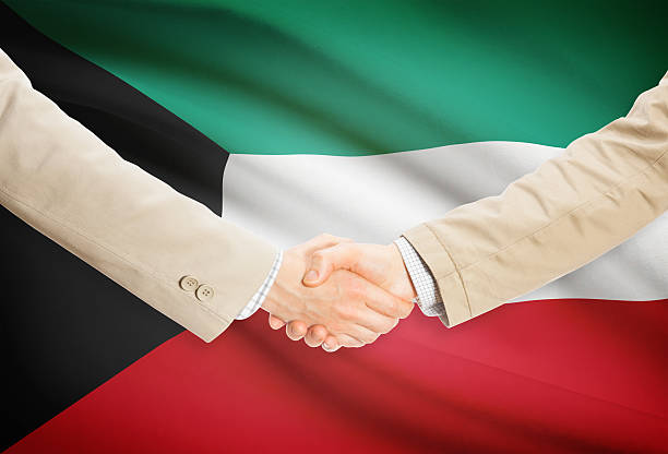 istock Businessmen handshake with flag on background - Kuwait 474746532