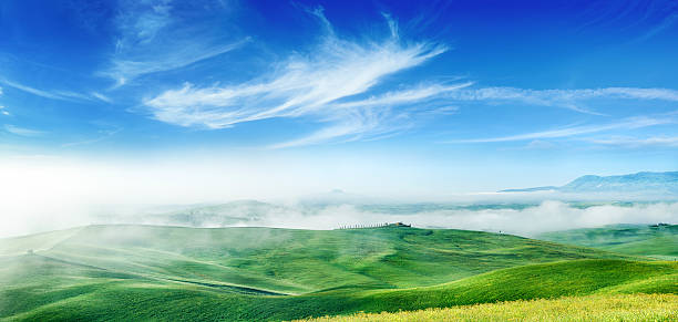 istock Misty sunrise over green fields of Tuscany 474747041