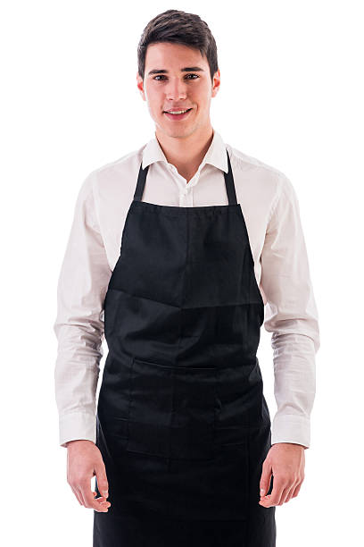 istock Young chef or waiter wearing black apron isolated 474749926