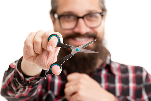 istock Hipster Man About To Cut His Beard 474752934