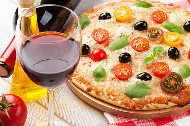 istock Italian pizza and red wine 474753320