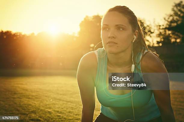 Sporting In The Sunset Stock Photo - Download Image Now - Exercising, Human Face, Lens Flare