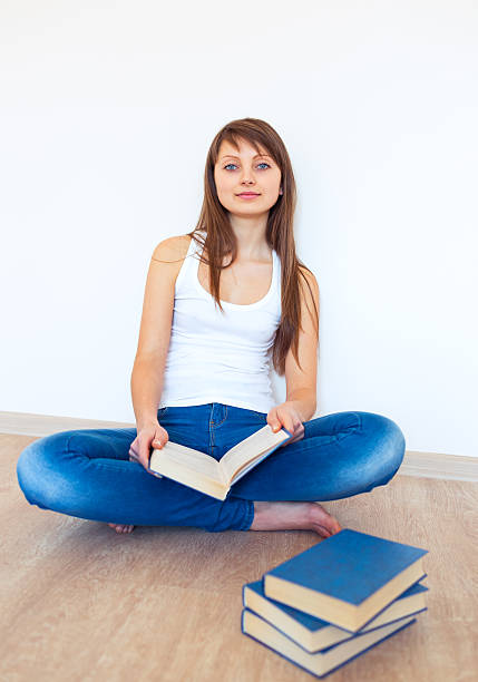 istock Young caucasian brunette reading a book 474756153