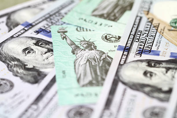 istock Hundred dollar bills with US Treasury checks 474757074