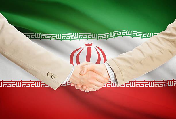 istock Businessmen handshake with flag on background - Iran 474757212