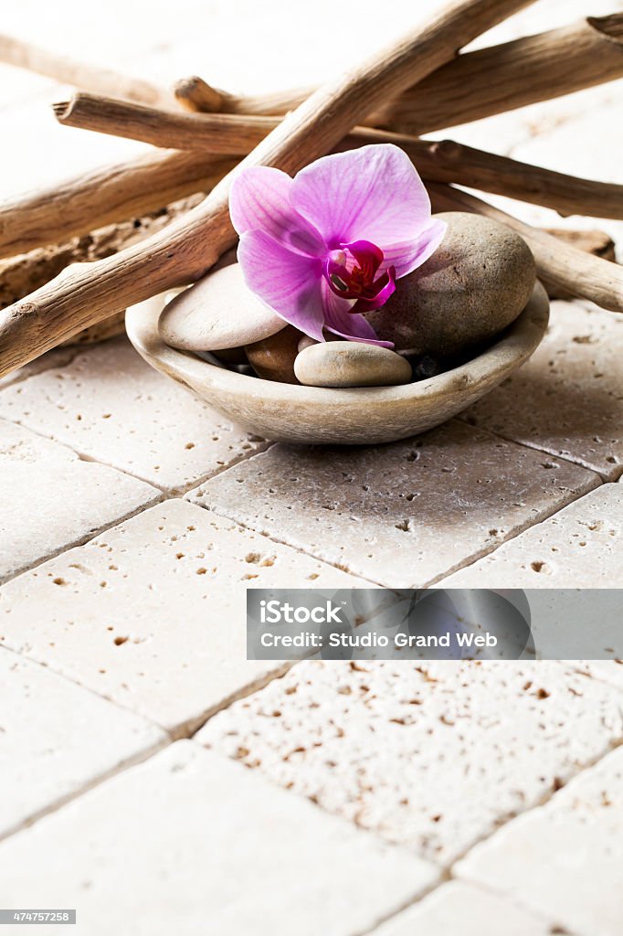 drift wood on beige stones for soft spa decor feminine symbols of purity with stones and wood on mineral stone background 2015 Stock Photo