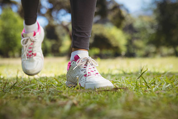 istock Fit woman jogging in the park 474767702