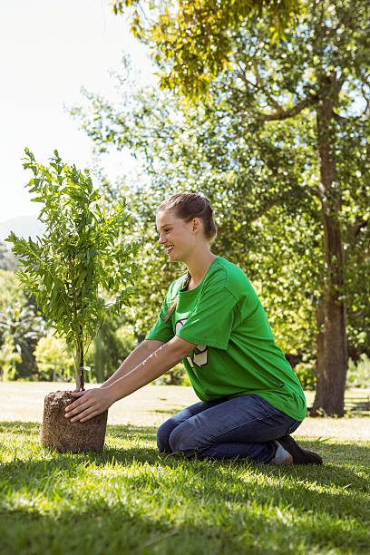 istock Environmental activist about to plant tree 474768094