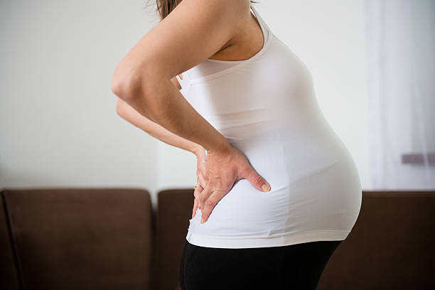 Pregnancy backache stock photo