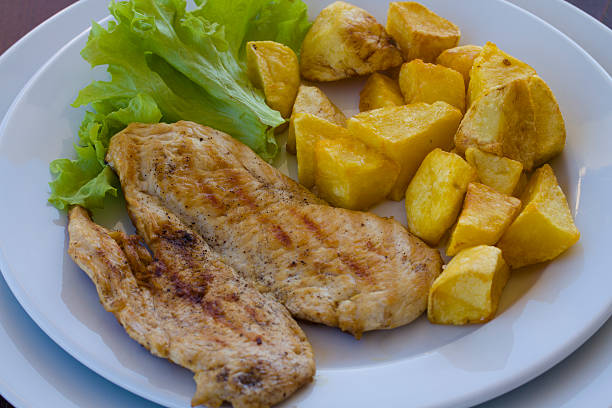 istock Pork chop, boiled potatoes and vegetables 474778802