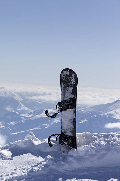 istock Snowboard in snow on off-piste slope at sun day 474778894