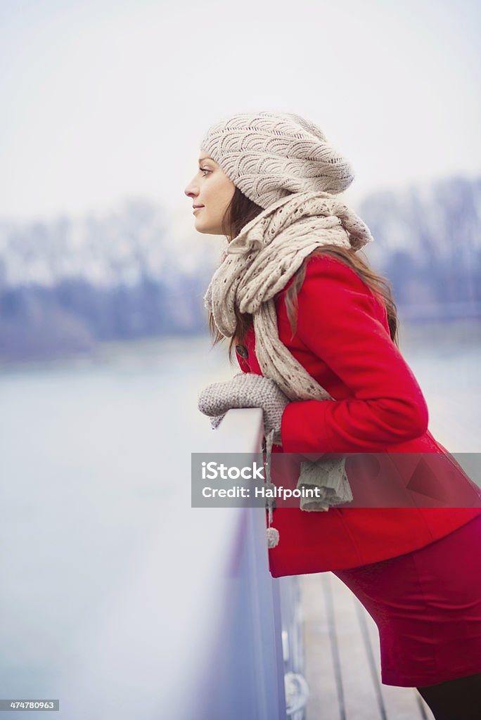 Winter portrait of beautiful pregnant woman Winter outdoor portrait of pregnant woman in fashionable clothes standing by the river Abdomen Stock Photo