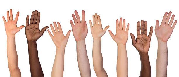 molte mani in - human hand hand raised volunteer arms raised foto e immagini stock