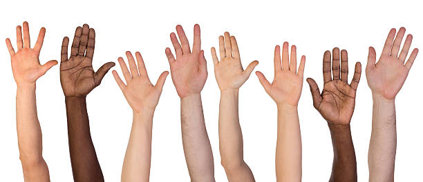 wiele ręce w - hand raised arms raised multi ethnic group human hand zdjęcia i obrazy z banku zdjęć