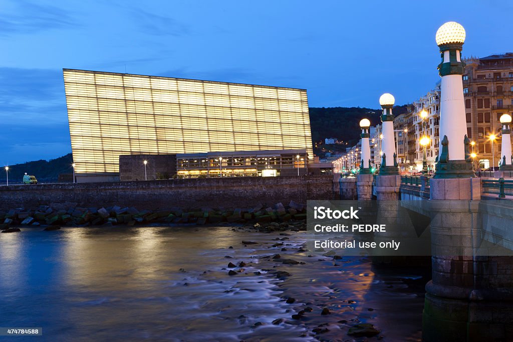 Kursaal Congress Centre San Sebastian, Spain - April 30, 2015: Sunset in the Zurriola bridge over the river Urumea adjacent to the Kursaal Conference Center, in San Sebastian, Spain. Kursaal Palace Stock Photo