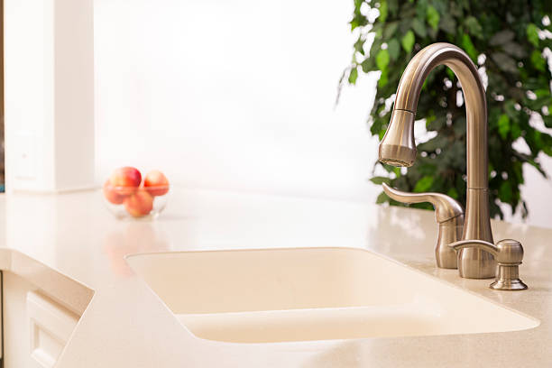 istock Empty kitchen sink. White countertop, stainless steel faucet. 474784632