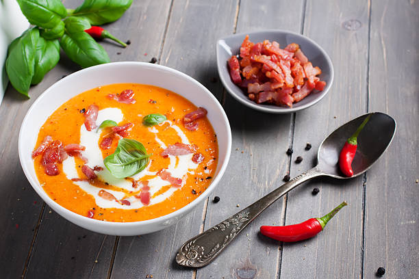 istock Carrot sweet pepper cream soup with bacon 474787370