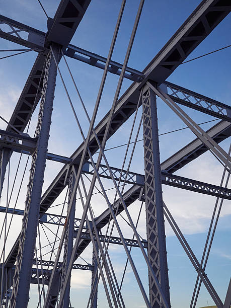 istock Detail of painted riveted bridge against blue sky. 474787996