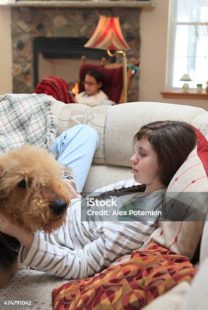 Two Sisters Teenager Girls Playing With Tablet And Smartphone Stock Photo - Download Image Now