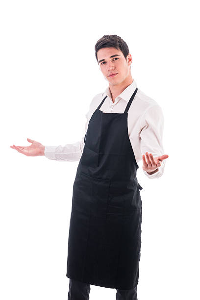istock Young chef or waiter wearing black apron isolated 474791124