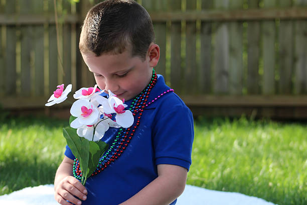 istock Boy Smelling the Flowers 474791258