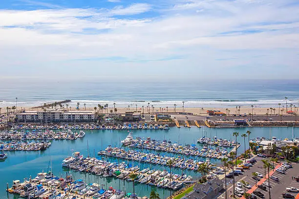 Photo of Oceanside view over Harbor Marina to ocean sail boats