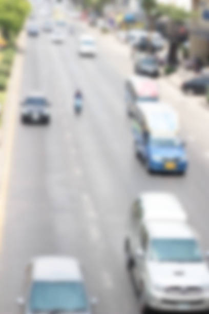 istock blurred of car on road 474795098