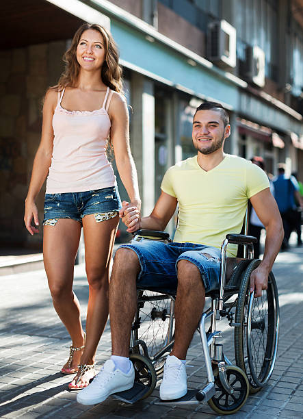 istock Disabled man in wheelchair outdoor 474795948