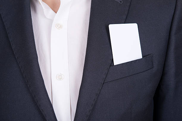 istock White card sticking out of his jacket pocket 474798321