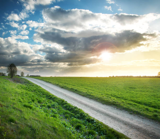 istock Evening country road with dramatic sky 474798866