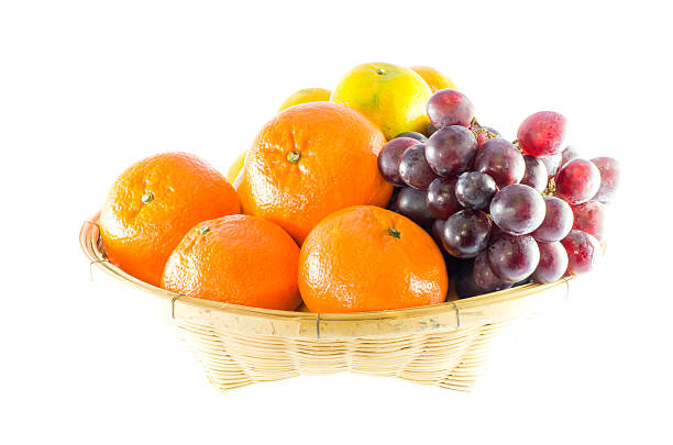 mixed fruit in basket stock photo