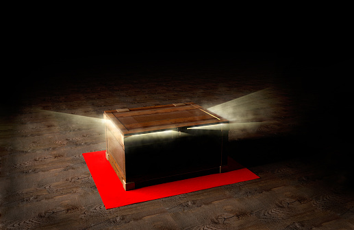 3d rendering of wooden chest with light and smoke coming from inside.