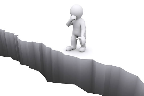 istock White man thinking in front of crack floor. 474807944