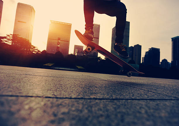 istock skateboarder doing skateboarding trick ollie on city 474808028