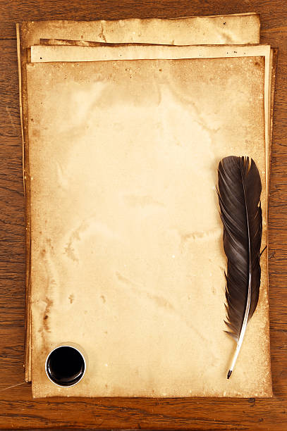 istock old paper on brown wood texture with feather and ink 474808776