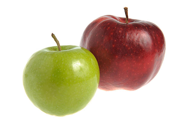 istock Two red and green apples isolated on white 474809525