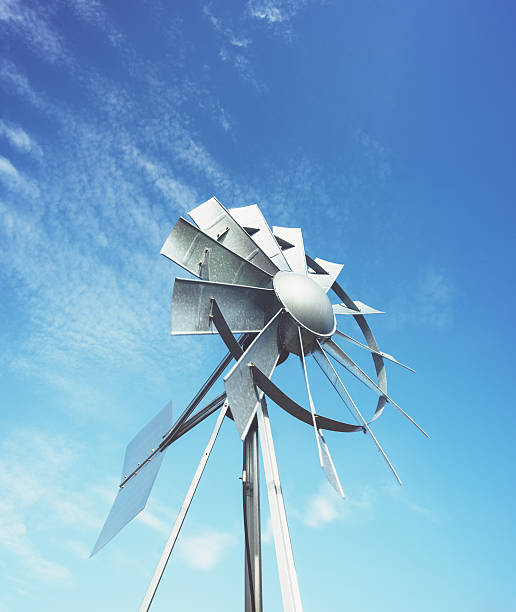 molino de viento en el cielo - metal tin cloud vertical fotografías e imágenes de stock