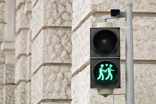 Traffic light Vienna for more tolerance Traffic light Vienna for more tolerance, stoplight with same-sex symbol ampelmännchen photos stock pictures, royalty-free photos & images