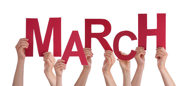 istock Many People Hands Holding Red Word March Blue Sky 474821484