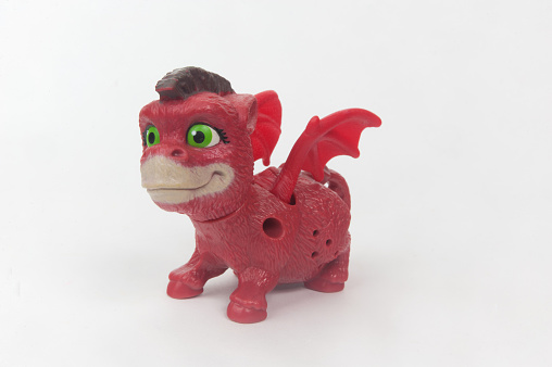 Adelaide, Australia - May 1, 2015: A studio shot of a Shrek Baby Dragon McDonalds Happy Meal Toy. The toy was distributed with Mcdonalds Childrens Happy Meals to help promote the release of the movie in cinemas. The Shrek series of movies proved to be very popular with movie goers worldwide.