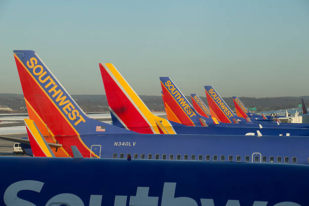 Southwest Airlines Boeing 737s in Baltimore Baltimore, Maryland, USA - March 7, 2015 : A row of Southwest Airlines Boeing 737s at Baltimore International (BWI). boeing 737 photos stock pictures, royalty-free photos & images