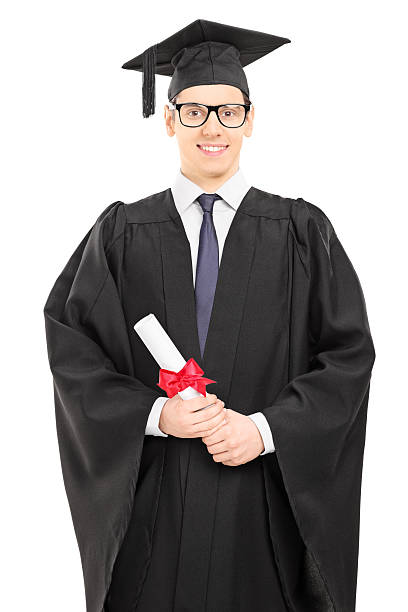istock Young male college graduate posing with diploma in hand 474841079